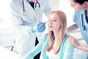 woman-prepares-for-surgery-with-doctor